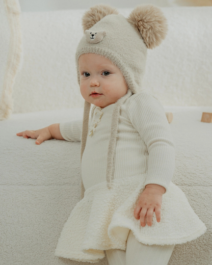 Crèmekleurig jurkje met teddystof