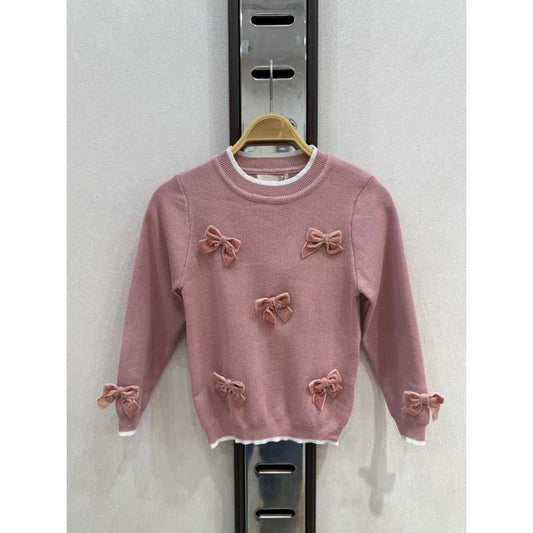 Roze truitje met strikken